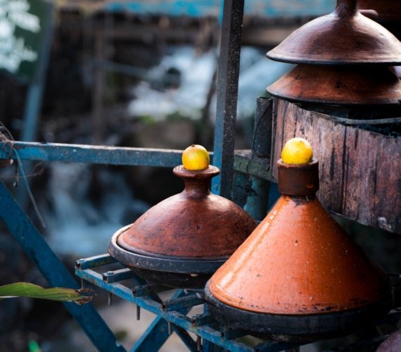 Brightly painted traditional Moroccan tagine cooking pots on display in Chefchaouen